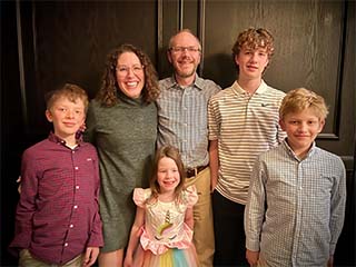Josh and Carolyn Denny with their children.